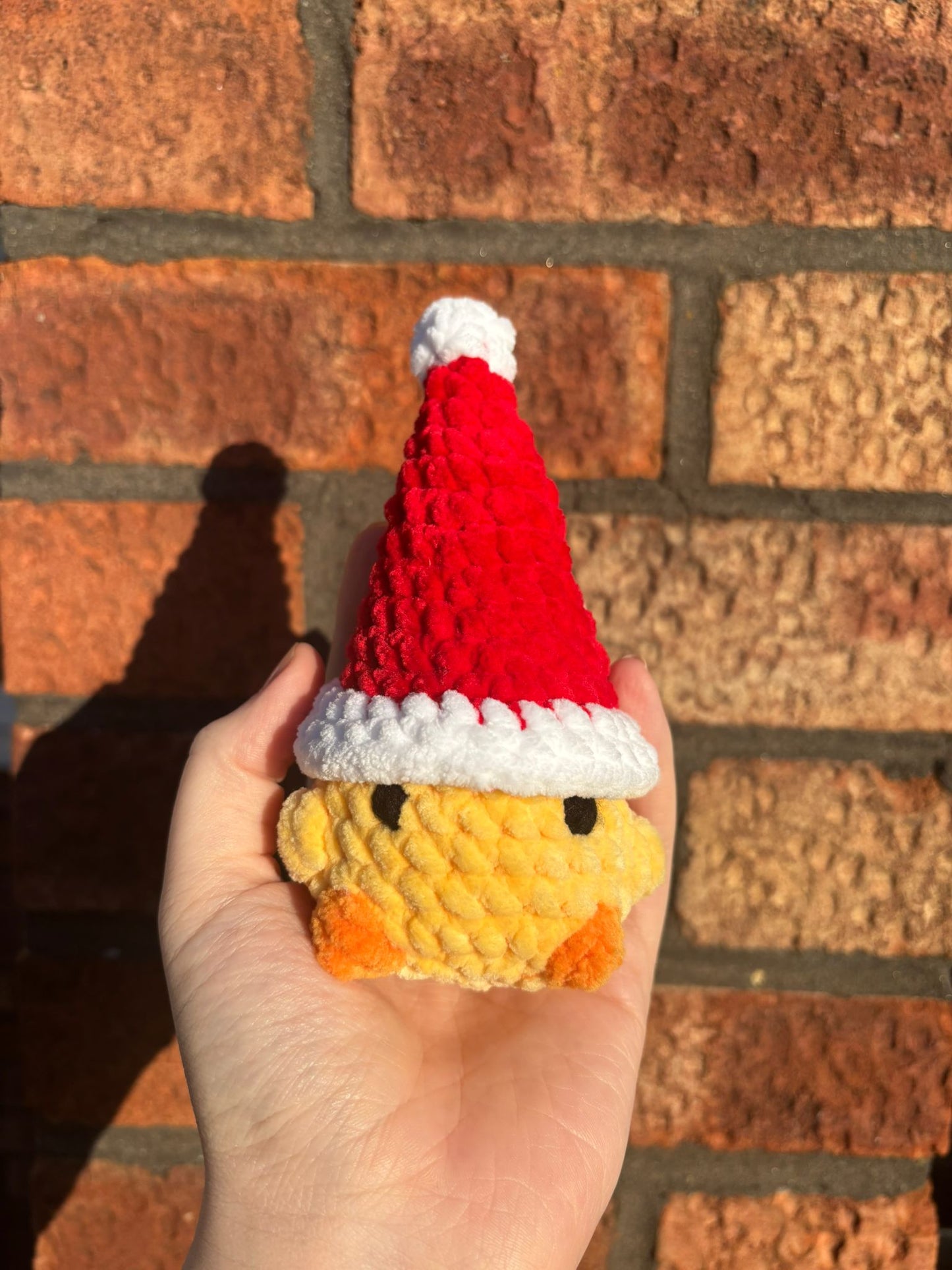 Crochet Christmas Chick - chicken plushie wearing a santa hat